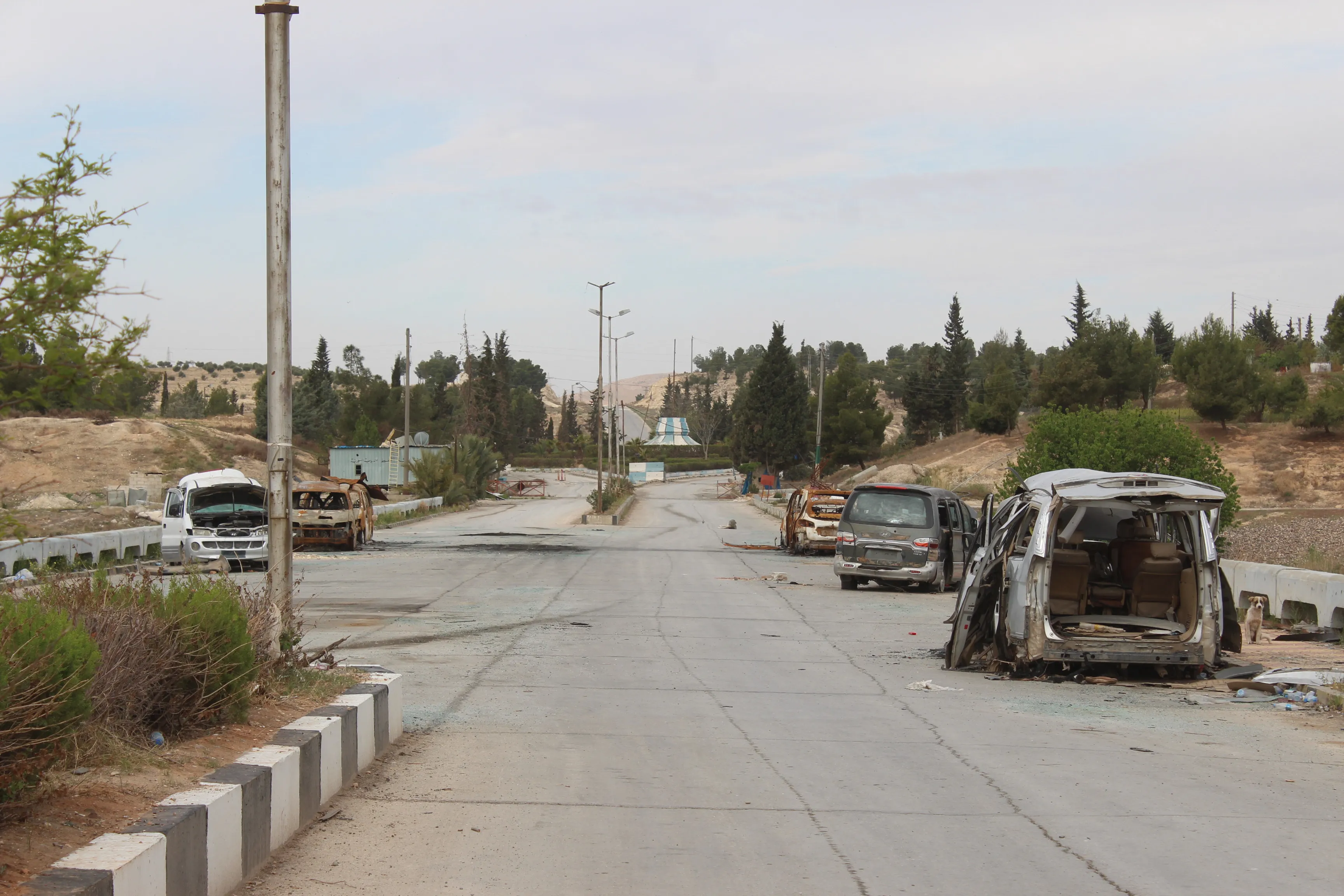 On the road from Tishrin dam towards the front, with some of the cars destroyed by enemy drones, April 2025. Credit: TA